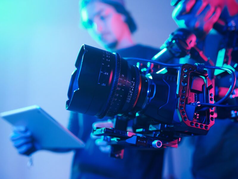 Close up,Of,Operator,Using,Professional,Camera,During,Shooting,With,Director